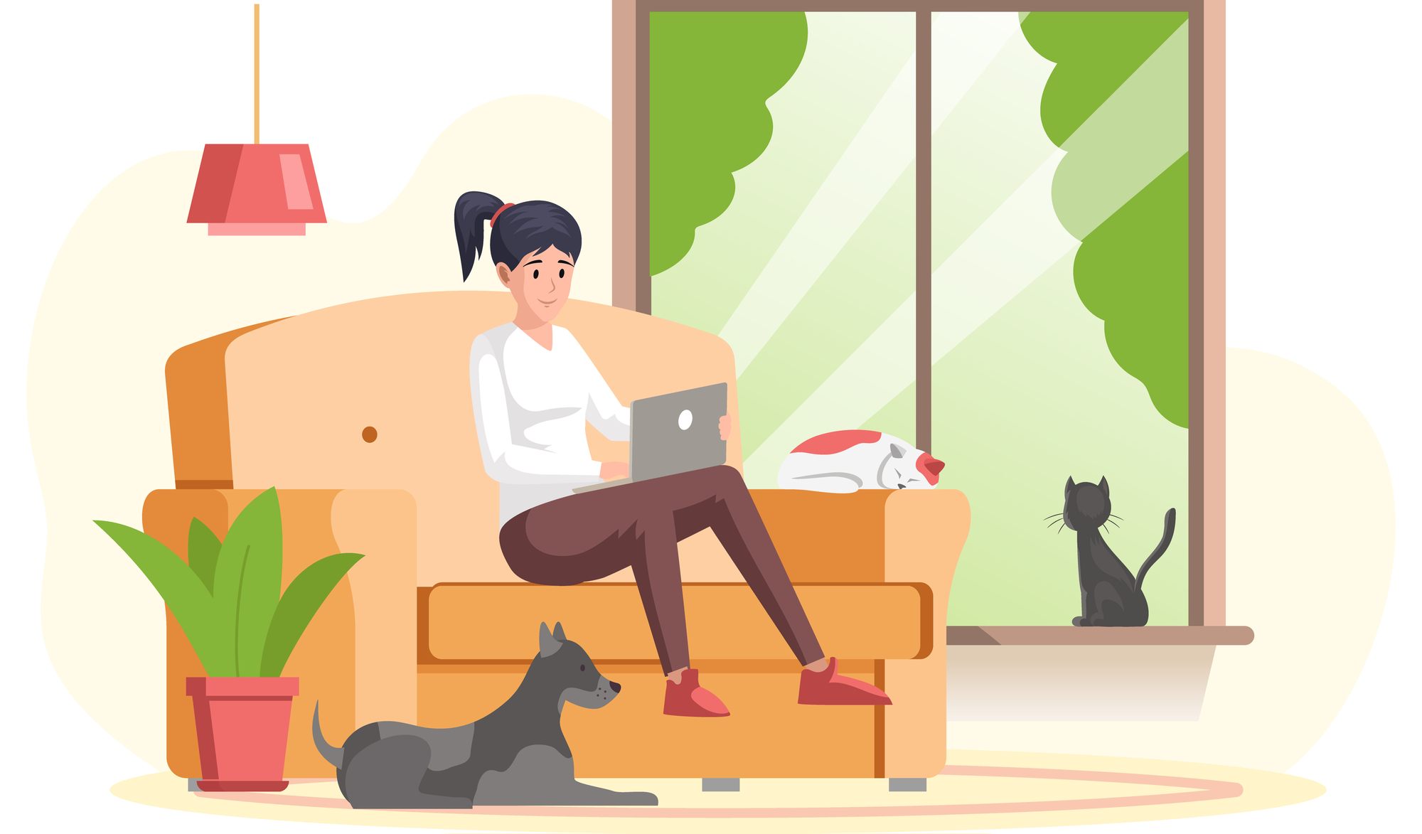 Young woman working on her laptop at home with her dog and cat looking on